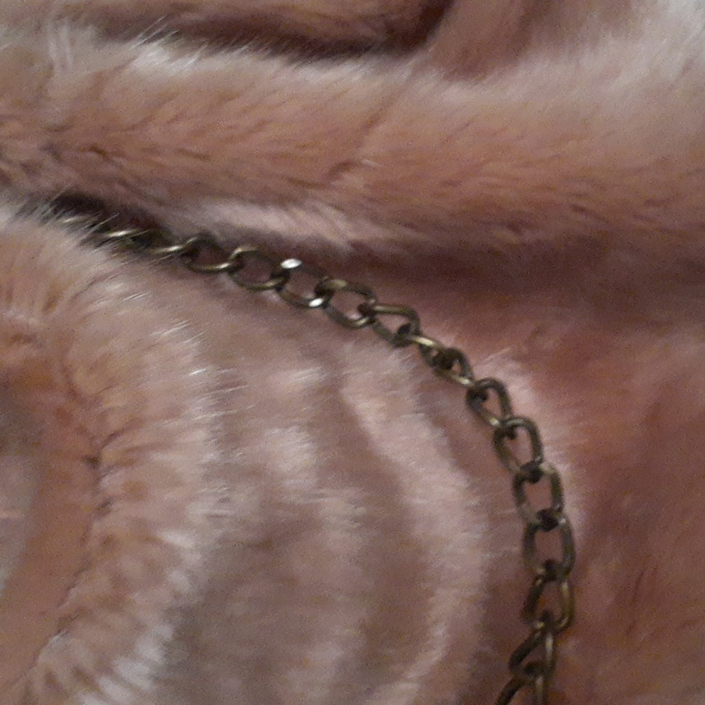 unique faux fur blush colored handbag. Brand New.
